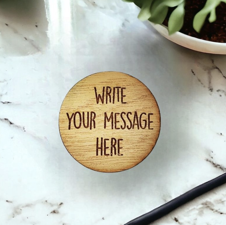 Wooden token with the message 'Write Your Message Here' on the front. 