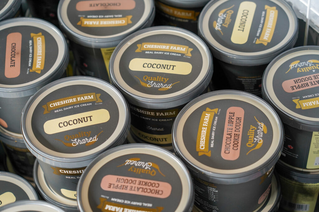 Tubs of ice cream in chocolate and coconut flavour at The Ice Cream Farm in Cheshire.