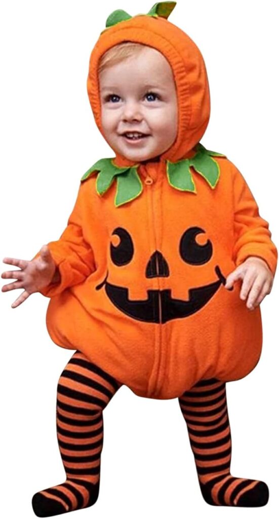 A baby is in a halloween pumpkin outfit