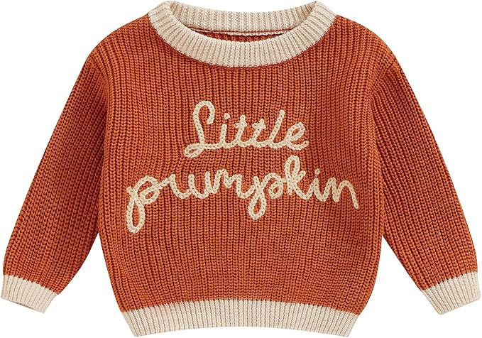 An orange jumper for baby with 'Little Pumpkin' written across in cream stitching