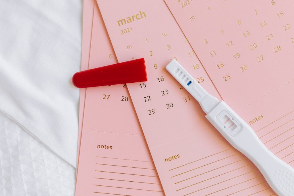 Close-up of a pregnancy test on March 2021 calendar, symbolizing expecting news.